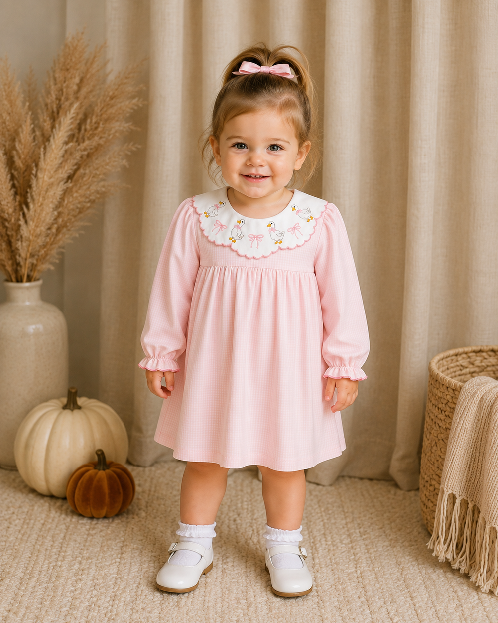 Pink gingham Peter Pan collar dress with duck embroidery, puff sleeves, worn by child