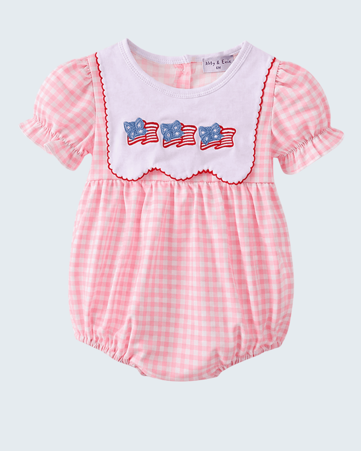 Pink checkered baby romper with American flag design on a white background