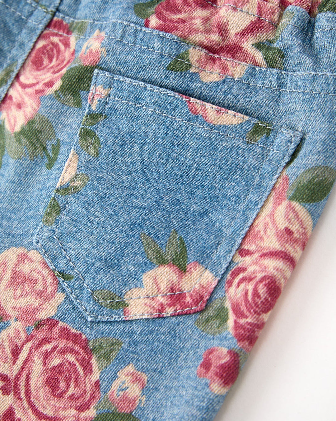Denim bell-bottom pants pocket detail, rose floral print and stitching