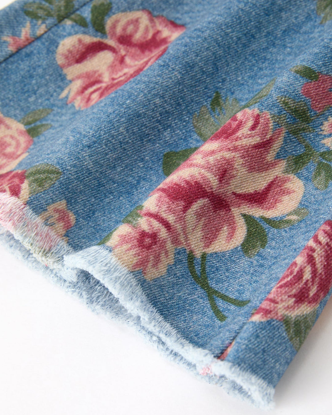 Denim bell-bottom pants hem, rose floral print and frayed edge