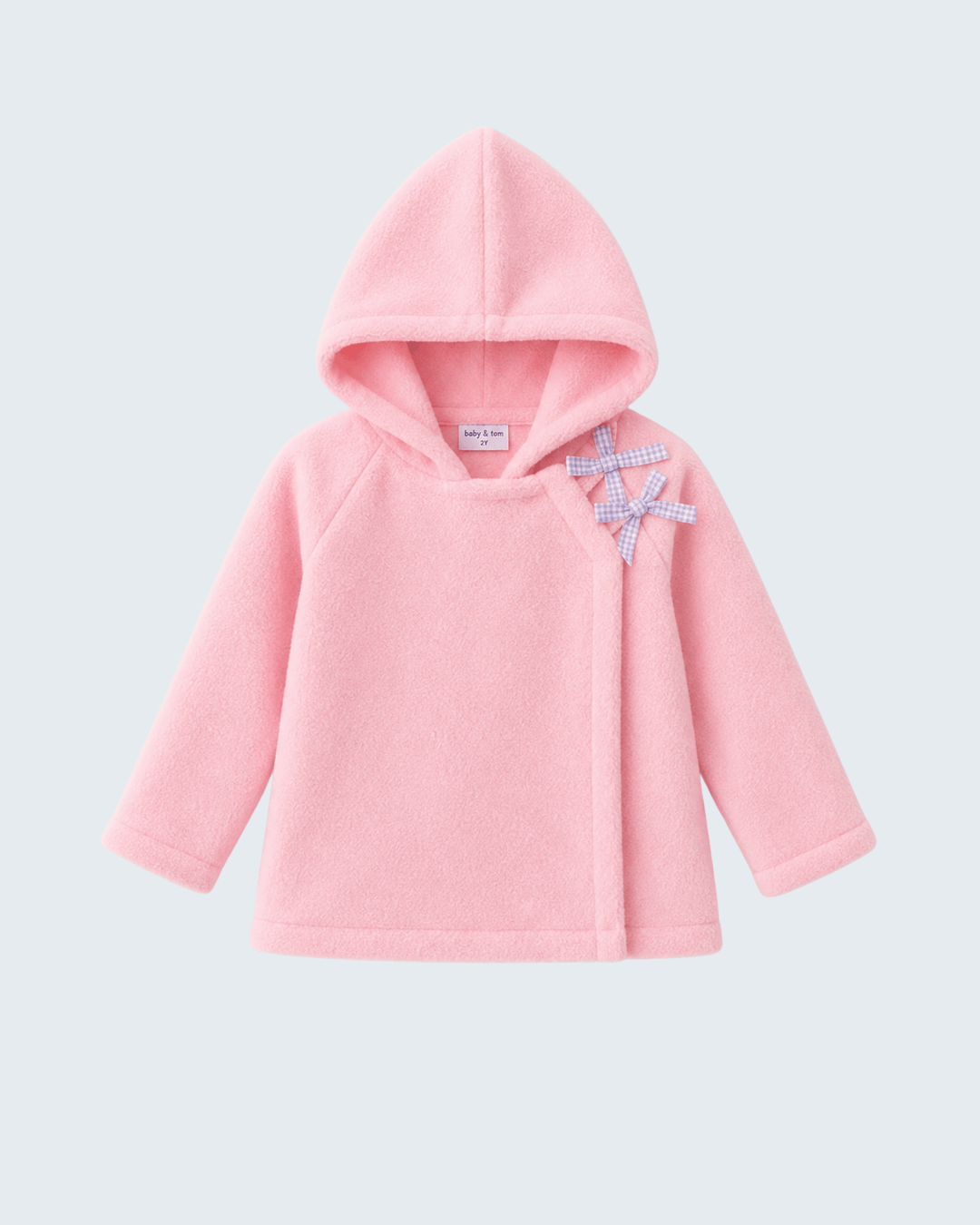 Pink fleece hooded coat with bow ornament at chest and soft, textured fabric.
