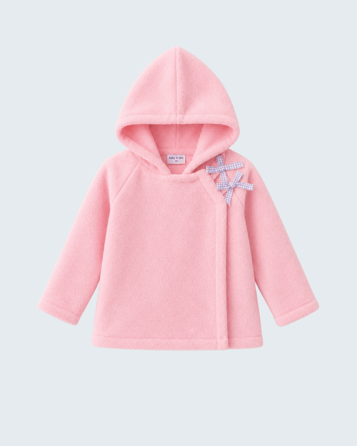 Pink fleece hooded coat with bow ornament at chest and soft, textured fabric.
