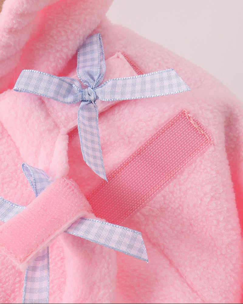 Pink fleece coat with bow applique on chest and small zippered-look pocket.