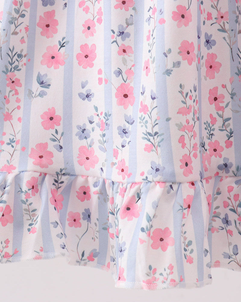 Floral dress with pink flowers and blue stripes on a white background