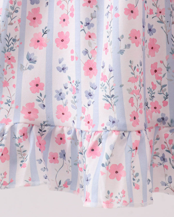 Floral dress with pink flowers and blue stripes on a white background