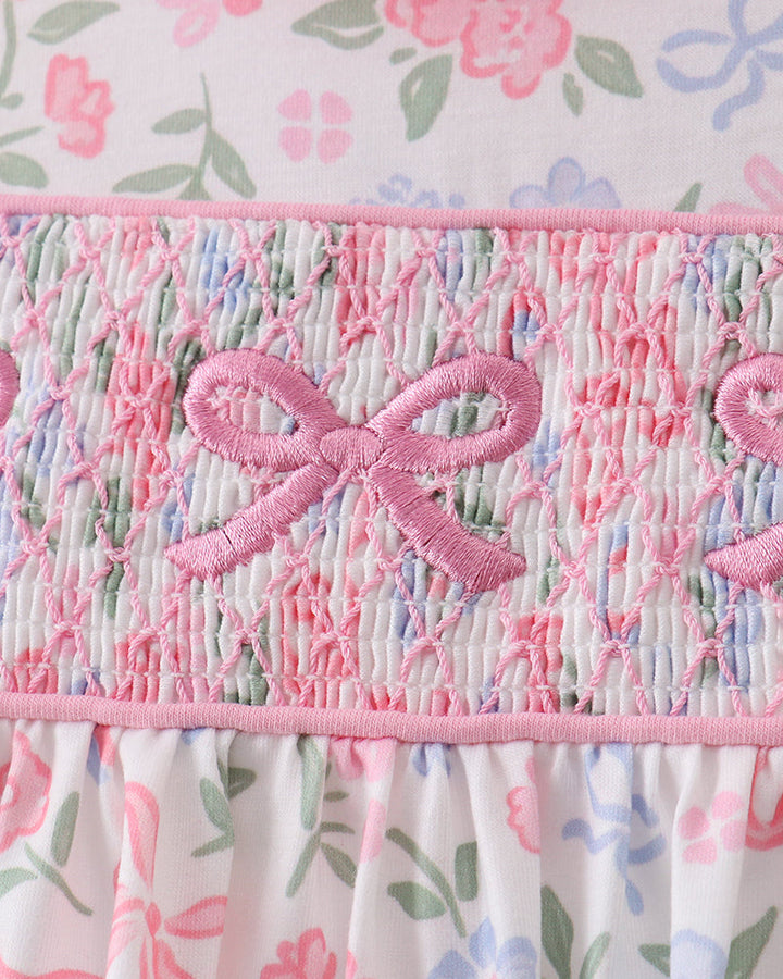 Close up on floral fabric with bow embroidery