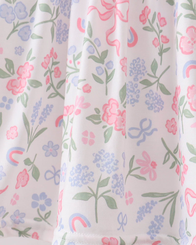 Floral and rainbow patterned fabric with a white background