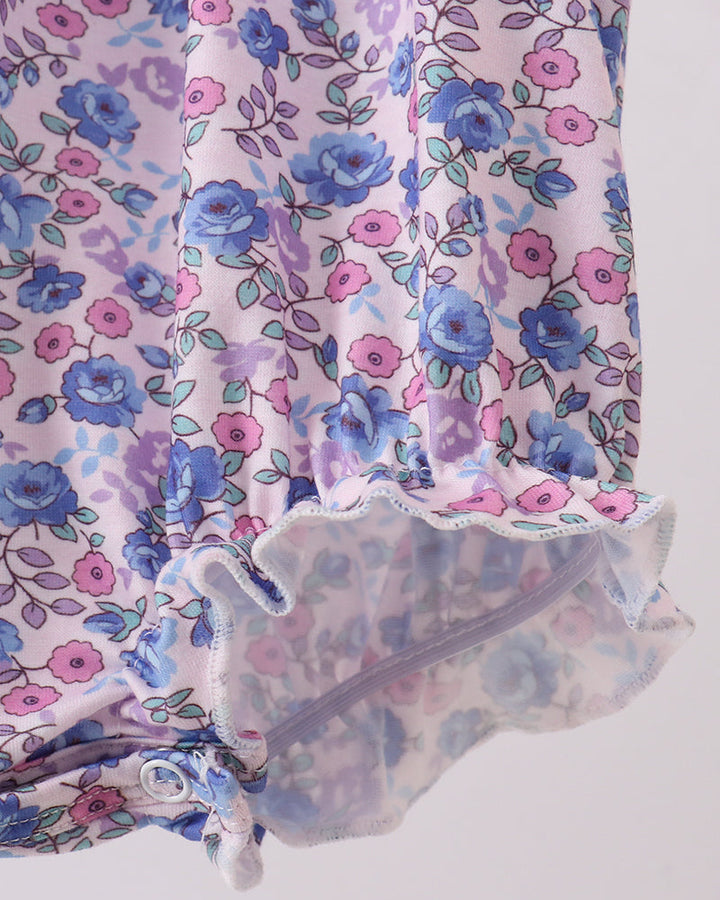 Floral patterned fabric with ruffled edge on a white background