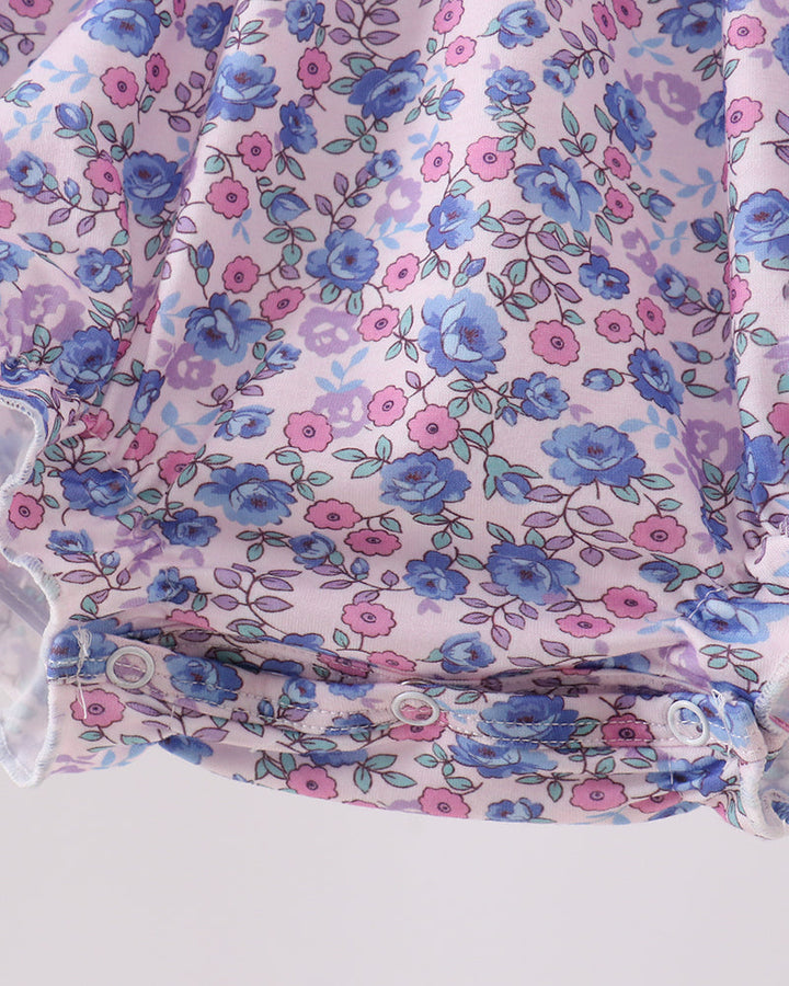 Floral fabric with blue and pink flowers on a white background