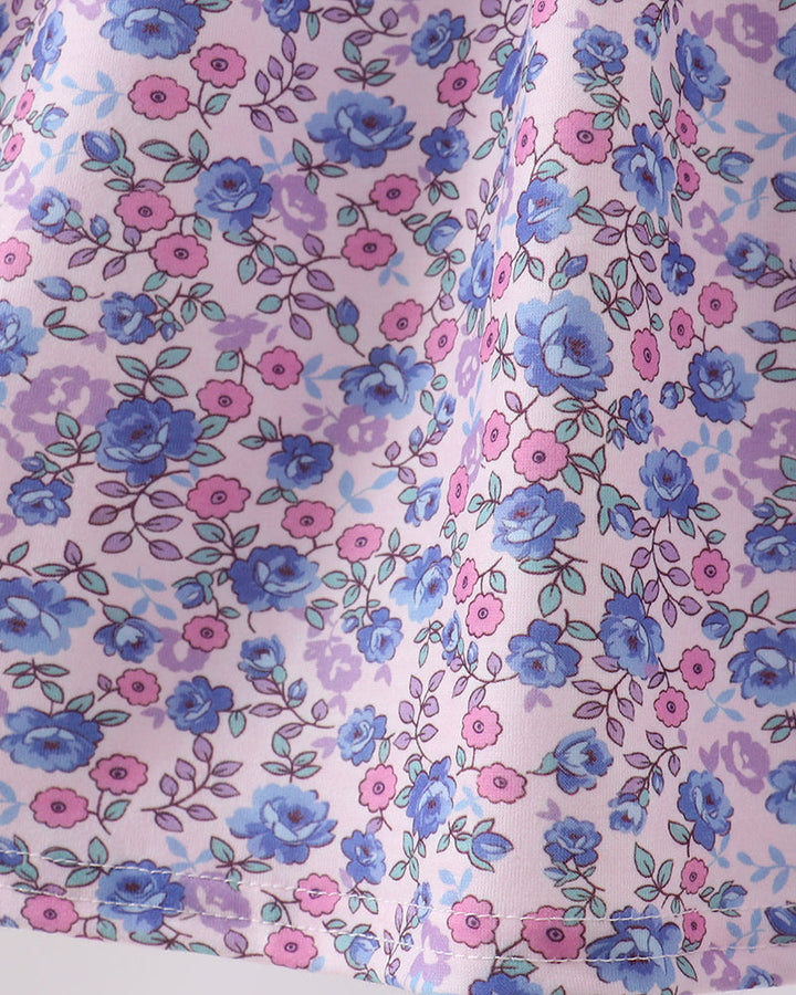 Floral pattern with blue and pink flowers on a light purple background