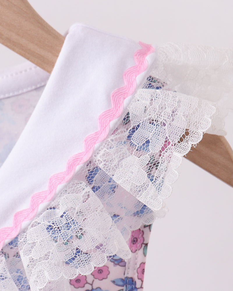 Dress with lace trim on a wooden surface