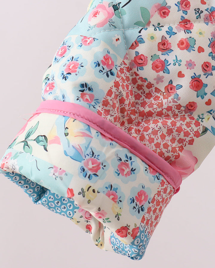 Floral patchwork jacket sleeve and hem with pink binding and ruffle
