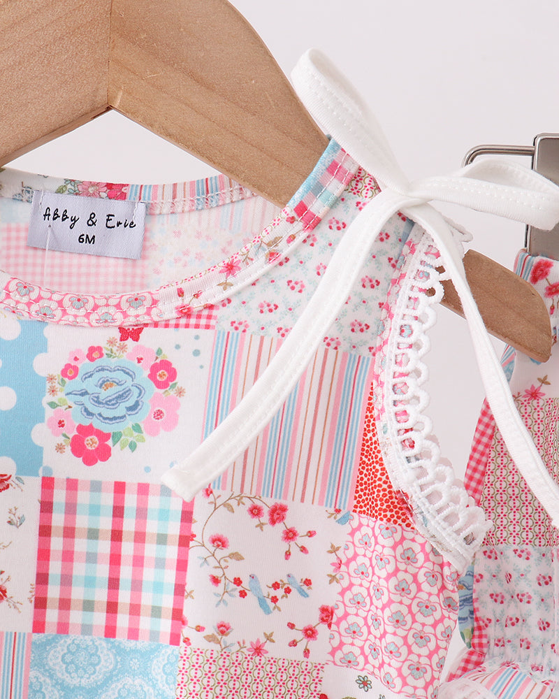Children's dress with patchwork pattern on a hanger