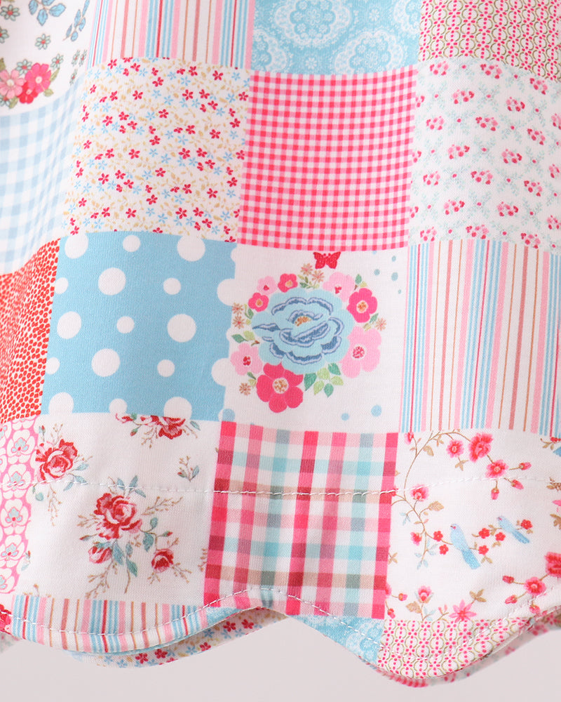 Patchwork fabric with floral, polka dot, and checkered patterns on a white background