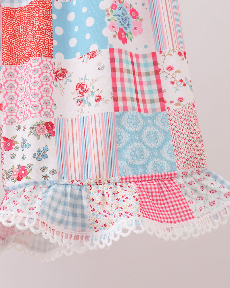 Patchwork fabric with floral, polka dot, and plaid patterns on a light gray background