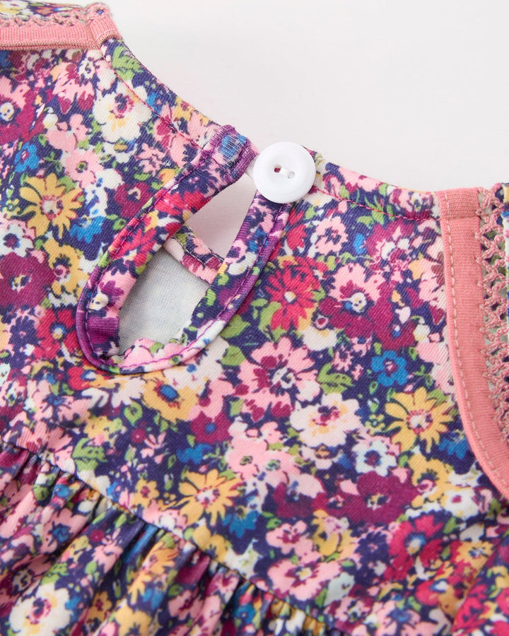Floral girls dress back with keyhole button and pink button placket detail