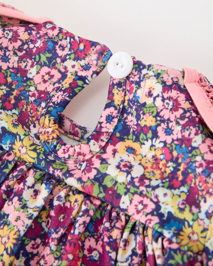 Girls floral dress neckline with button closure and Peter Pan petal collar