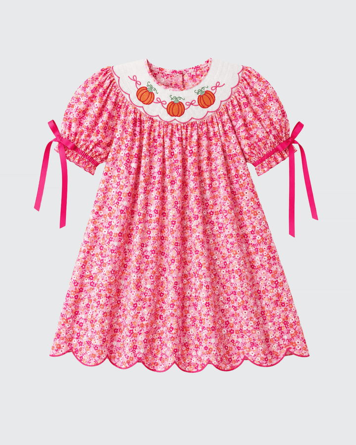 Pink floral twirl dress with pumpkin embroidered collar and short sleeves with bow ties