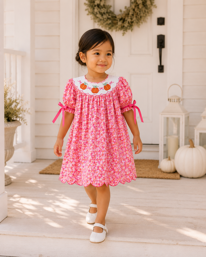 Pink floral twirl dress with pumpkin-embroidered scalloped collar and ribbon-tie sleeves