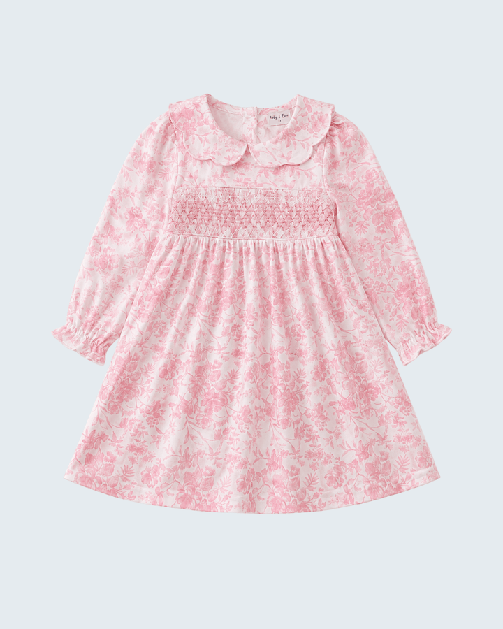 Pink floral smocked dress, long puff sleeves and round neckline
