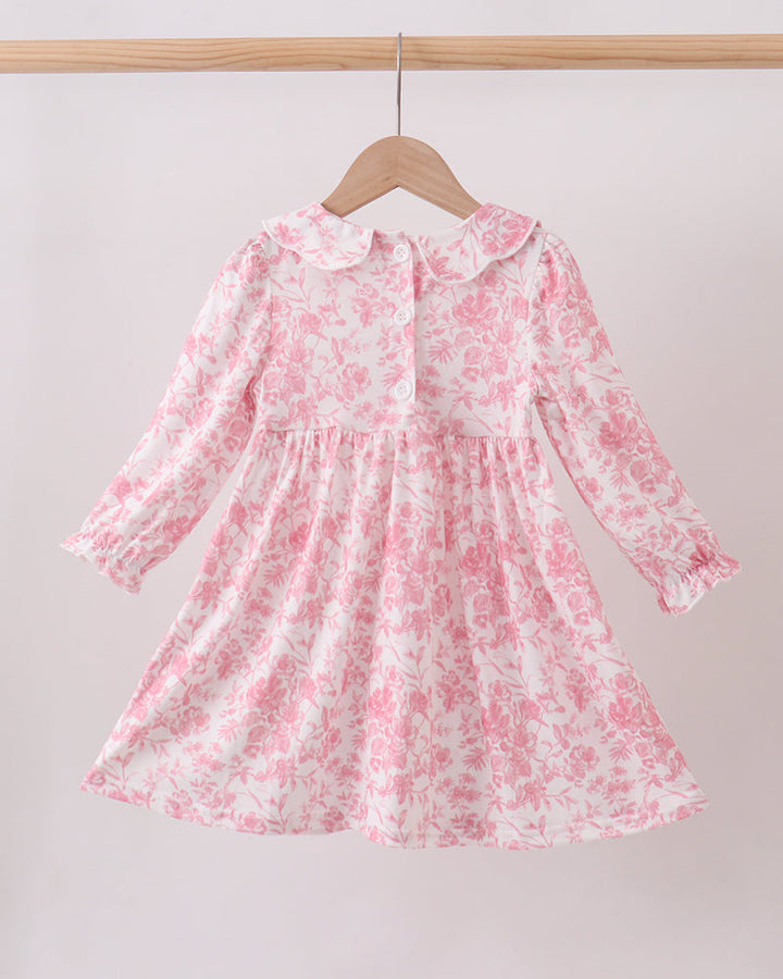 Pink floral long-sleeve smocked dress with ruffled collar and gathered full skirt