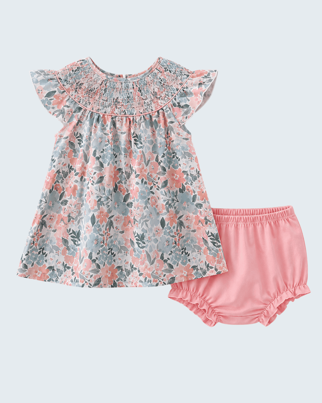 Floral dress and pink bloomers set on a light gray background