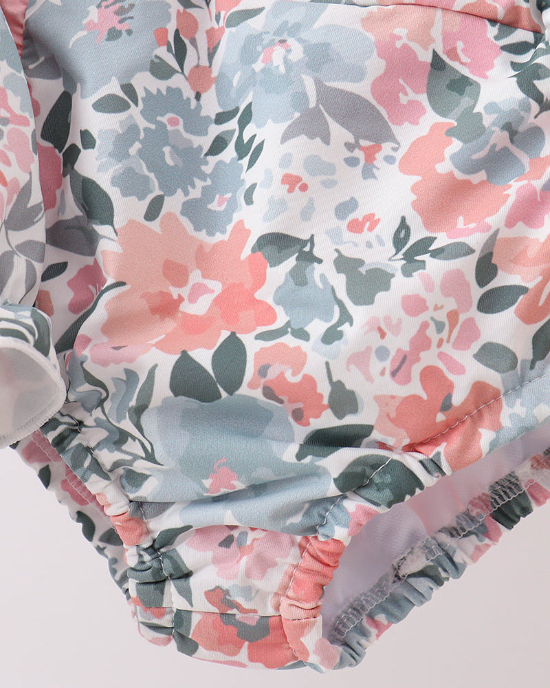 Floral-patterned swim bottoms on a light background