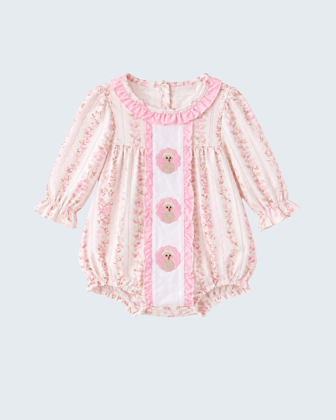 Pink floral bubble romper with three embroidered turkey medallion appliques and pintuck detailing