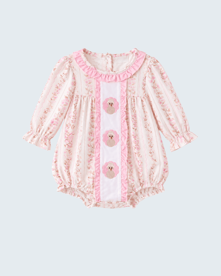 Pink floral bubble romper with three embroidered turkey medallion appliques and pintuck detailing