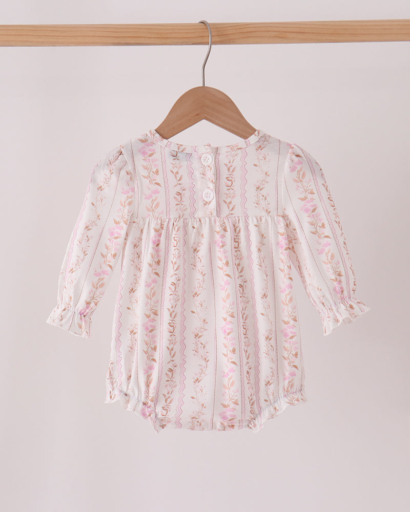 Pink floral bubble romper with long sleeves, gathered ruffle yoke, and turkey applique details