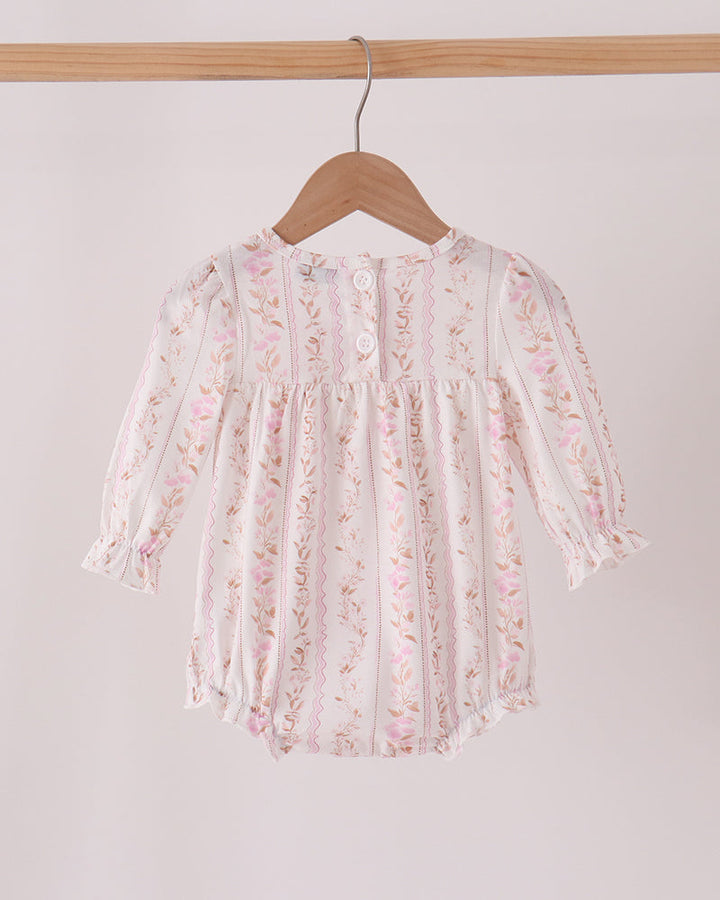 Pink floral bubble romper with long sleeves, gathered ruffle yoke, and turkey applique details