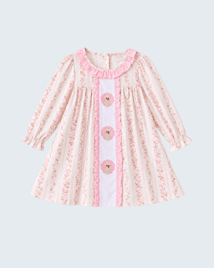 Pink floral ruffle dress with embroidered front panel and long sleeves