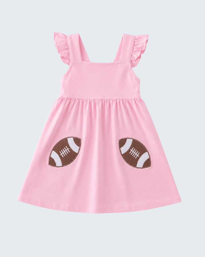 Pink sleeveless dress with football applique patches and ruffled shoulders