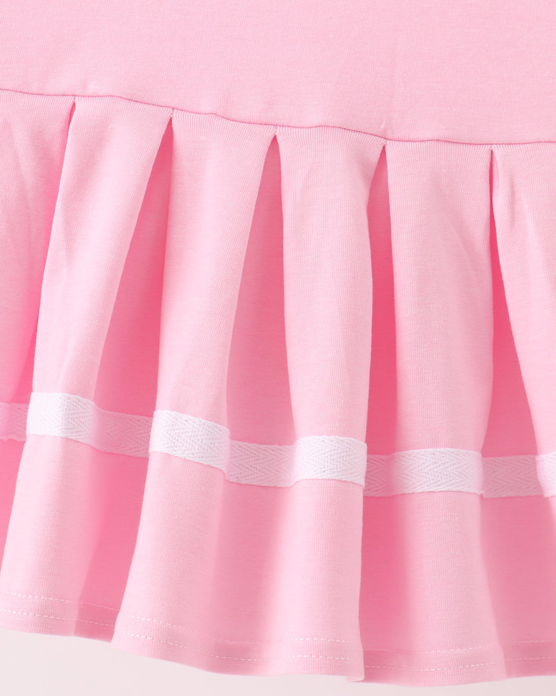 Pink pleated skirt with white striped hem