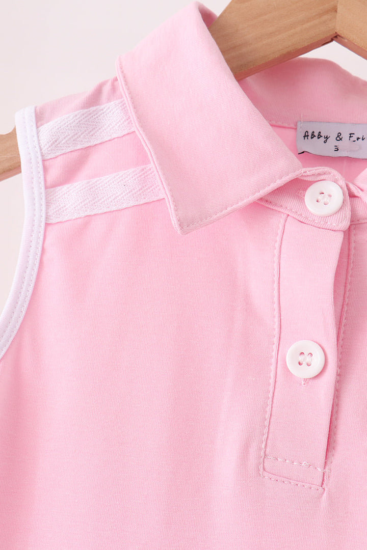 Pink sleeveless dress with buttoned polo collar and bow tab