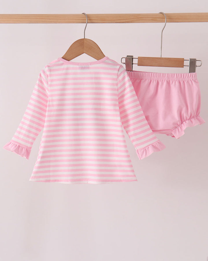 Pink and white striped long-sleeve top with pink bloomer shorts set, on hangers