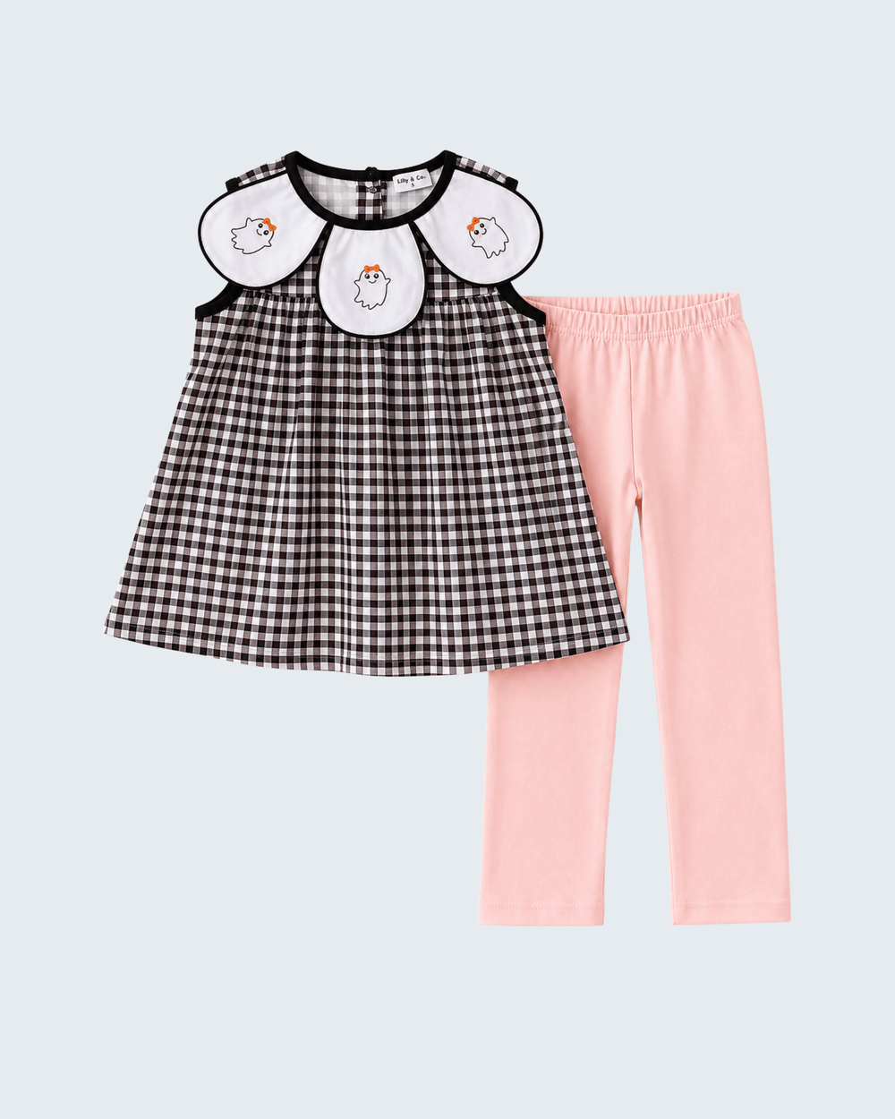 A toddler girl's two-piece outfit set featuring a black and white gingham dress with a white Peter Pan collar decorated with embroidered sheep, paired with light pink leggings, on a light gray background.