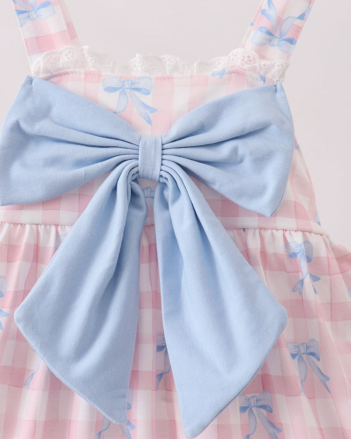 Dress with a large blue bow on a light background
