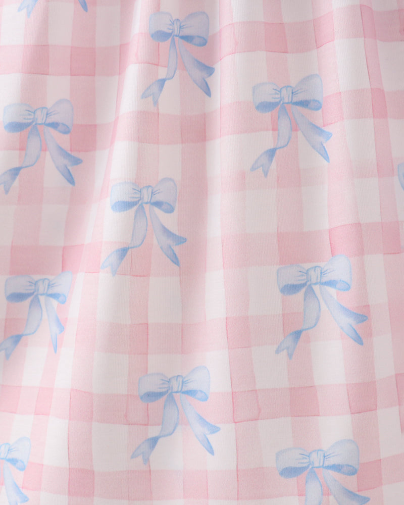 Pink checkered fabric with blue bows pattern