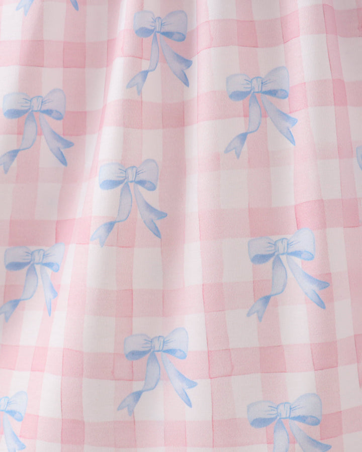 Pink checkered fabric with blue bows pattern