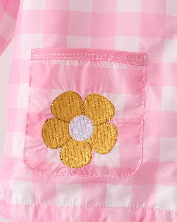 Pink gingham raincoat pocket with yellow flower applique and pink lining