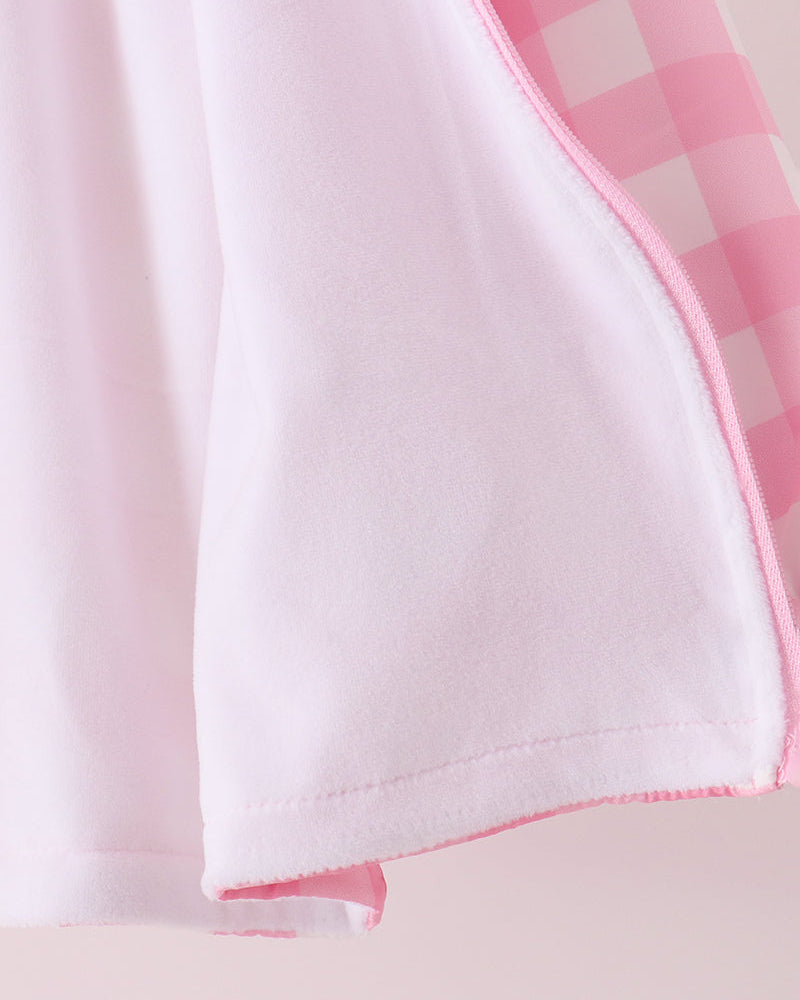 Pink gingham raincoat lower hem with pink stitched edging