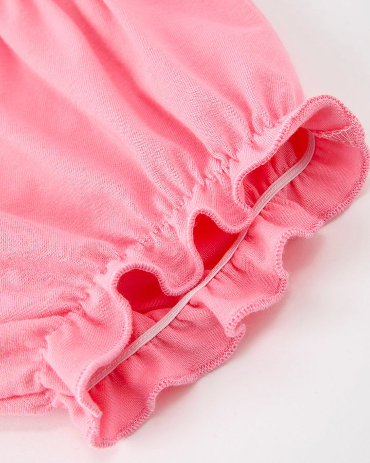 Pink girls bloomer shorts with ruffled edge and elastic trim on leg opening