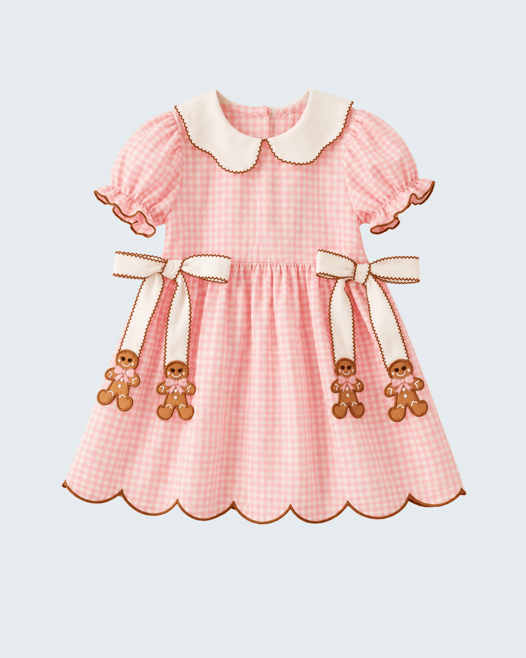 Pink gingham toddler dress with white Peter Pan collar and gingerbread bow appliques