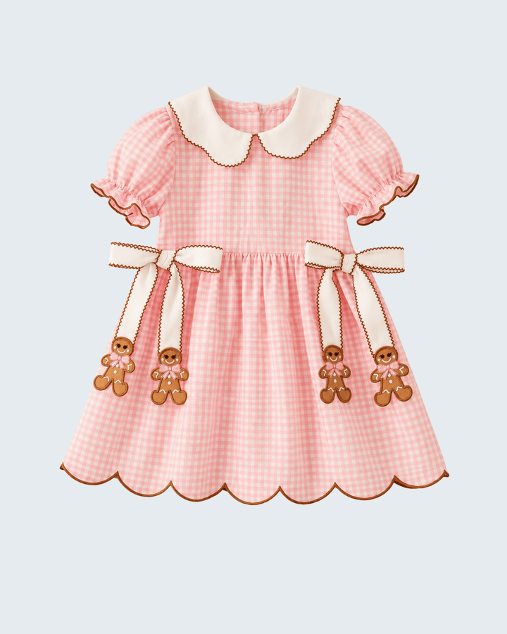 Pink gingham toddler dress with white Peter Pan collar and gingerbread bow appliques