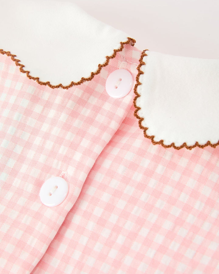 Girls pink gingham dress front with white scalloped Peter Pan collar and button placket