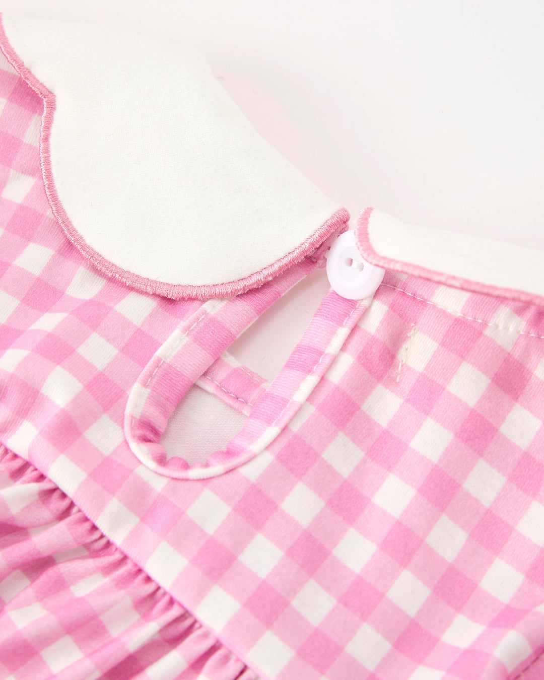Girls pink gingham bloomer set neckline with buttoned keyhole and ruffled waist