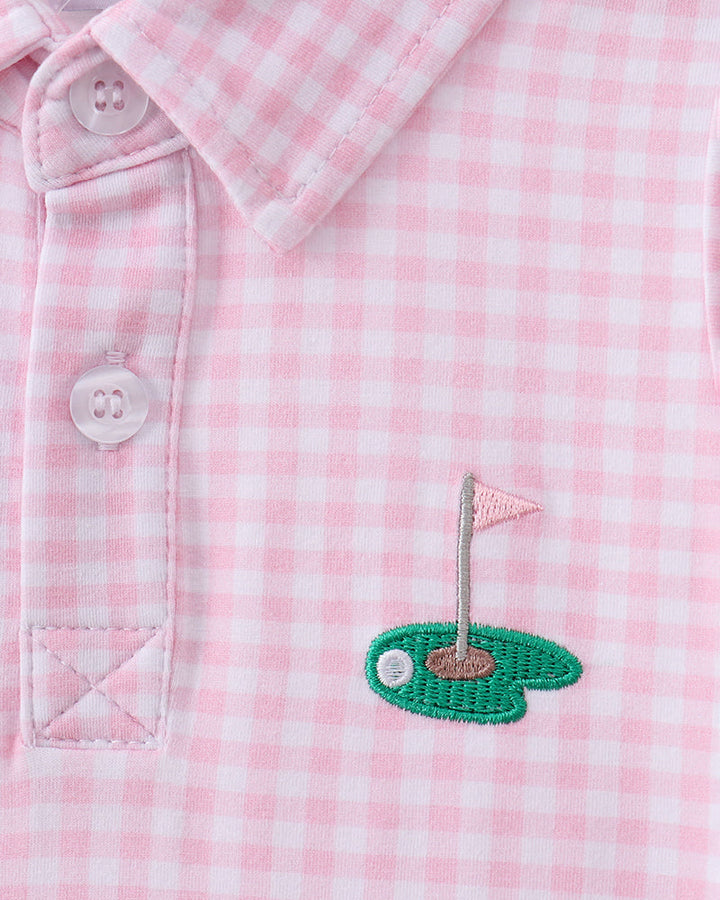 Pink gingham golf dress with collar, buttons, and embroidered golf hole