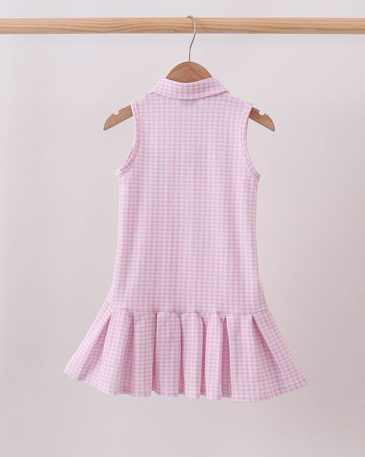 Pink gingham sleeveless golf dress with button placket and tiered ruffle skirt