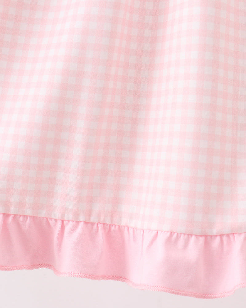 Pink gingham dress with ruffled hem and gathered waistline